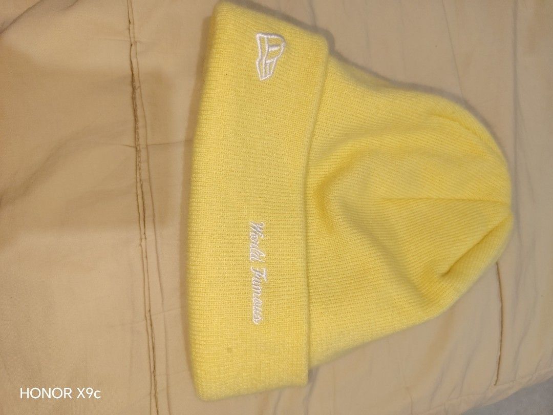 Supreme Box Logo Yellow Beanie (Category: Caps & Hats) located in Pasay City. Submitted by Komikss (Listing ID 1465245588, Image 2). Description: - Color: Bright yellow - Design: Classic red Supreme box logo with 'World Famous' and New Era side embroidery - Material: 100% acrylic - Origin: Made in China - Condition: Clean with interior tags intact - Mode of payment and shipping details available upon request -Authentic, Money if proven fake .