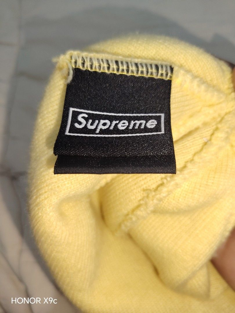 Supreme Box Logo Yellow Beanie (Category: Caps & Hats) located in Pasay City. Submitted by Komikss (Listing ID 1465245588, Image 3). Description: - Color: Bright yellow - Design: Classic red Supreme box logo with 'World Famous' and New Era side embroidery - Material: 100% acrylic - Origin: Made in China - Condition: Clean with interior tags intact - Mode of payment and shipping details available upon request -Authentic, Money if proven fake .