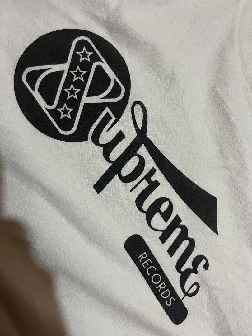 Supreme Records White Graphic Tee Size L (Category: Tshirts & Polo Shirts ) located in Manila. Submitted by adzwilnams67005 (Listing ID 1465330225, Image 2). Description: - Brand: Supreme - Style: Records graphic t-shirt - Color: White with black front print and star details - Size: L - Material: Pre-shrunk cotton (Made in USA) - Fit: Classic crew neck, short sleeves - Condition: Clean, solid streetwear piece Supreme records tees ‎ ‎Size L on tag