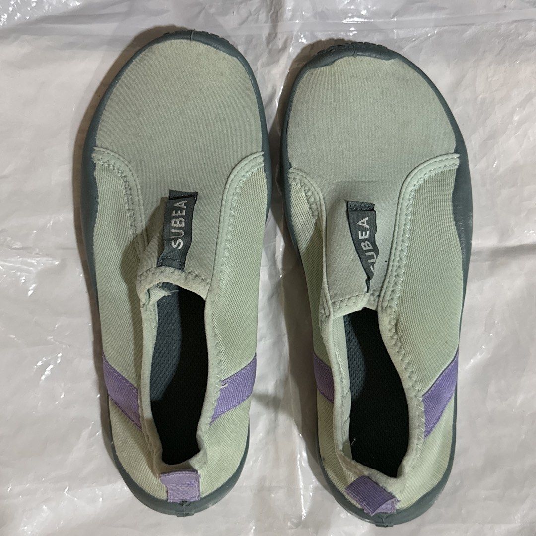 Swimming Shoes (Category: Sneakers) located in Makati City. Submitted by julyco. (Listing ID 1465360975, Image 1). Description: - Brand/Item: Subea water shoes - Colorway: Vibrant green and purple - Design: Slip-on style with a convenient heel pull tab for easy wear - Sole: Textured rubber soles providing reliable grip for water activities.