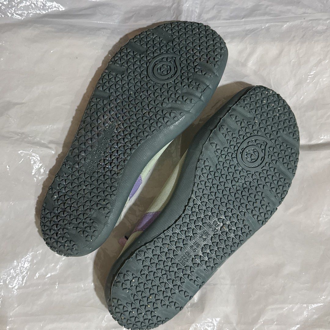 Swimming Shoes (Category: Sneakers) located in Makati City. Submitted by julyco. (Listing ID 1465360975, Image 3). Description: - Brand/Item: Subea water shoes - Colorway: Vibrant green and purple - Design: Slip-on style with a convenient heel pull tab for easy wear - Sole: Textured rubber soles providing reliable grip for water activities.