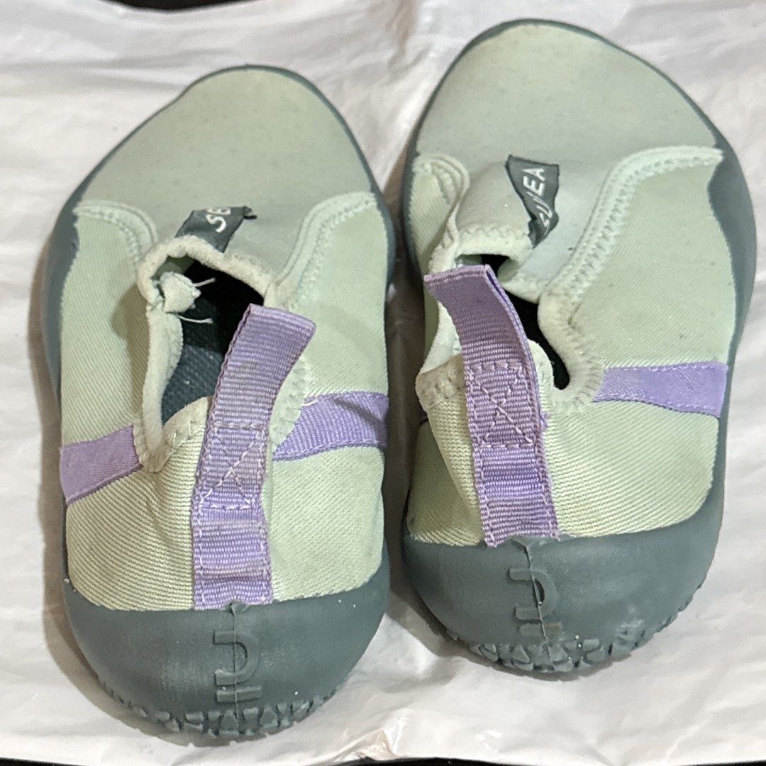 Swimming Shoes (Category: Sneakers) located in Makati City. Submitted by julyco. (Listing ID 1465360975, Image 2). Description: - Brand/Item: Subea water shoes - Colorway: Vibrant green and purple - Design: Slip-on style with a convenient heel pull tab for easy wear - Sole: Textured rubber soles providing reliable grip for water activities.