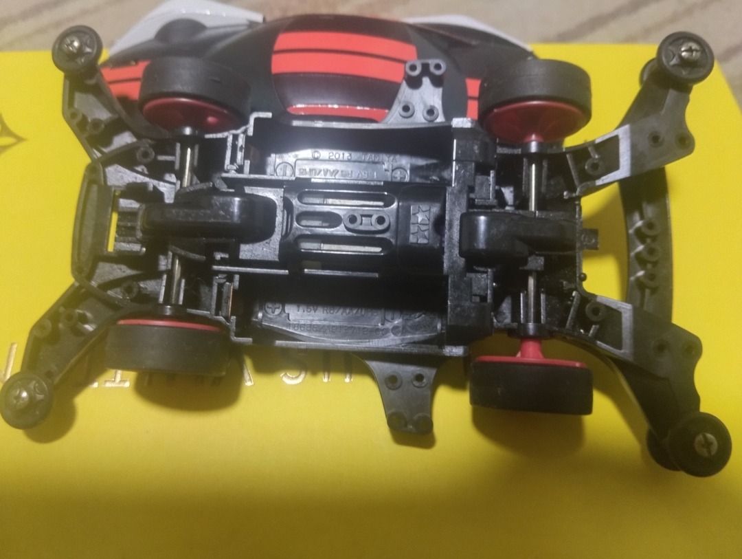 Tamiya Astralster Mini 4WD Car (Category: Vehicle & Diecast Models) located in Manila. Submitted by kalvin19ch13504 (Listing ID 1465377515, Image 1). Description: - Model: Tamiya Astralster Mini 4WD - Design: Black and white body with aggressive red racing stripes - Wheels/Tires: Eye-catching red wheels paired with black tires - Upgrades Included: Front and rear roller setup plus sturdy side stay attachments - Chassis: Standard motor mount layout