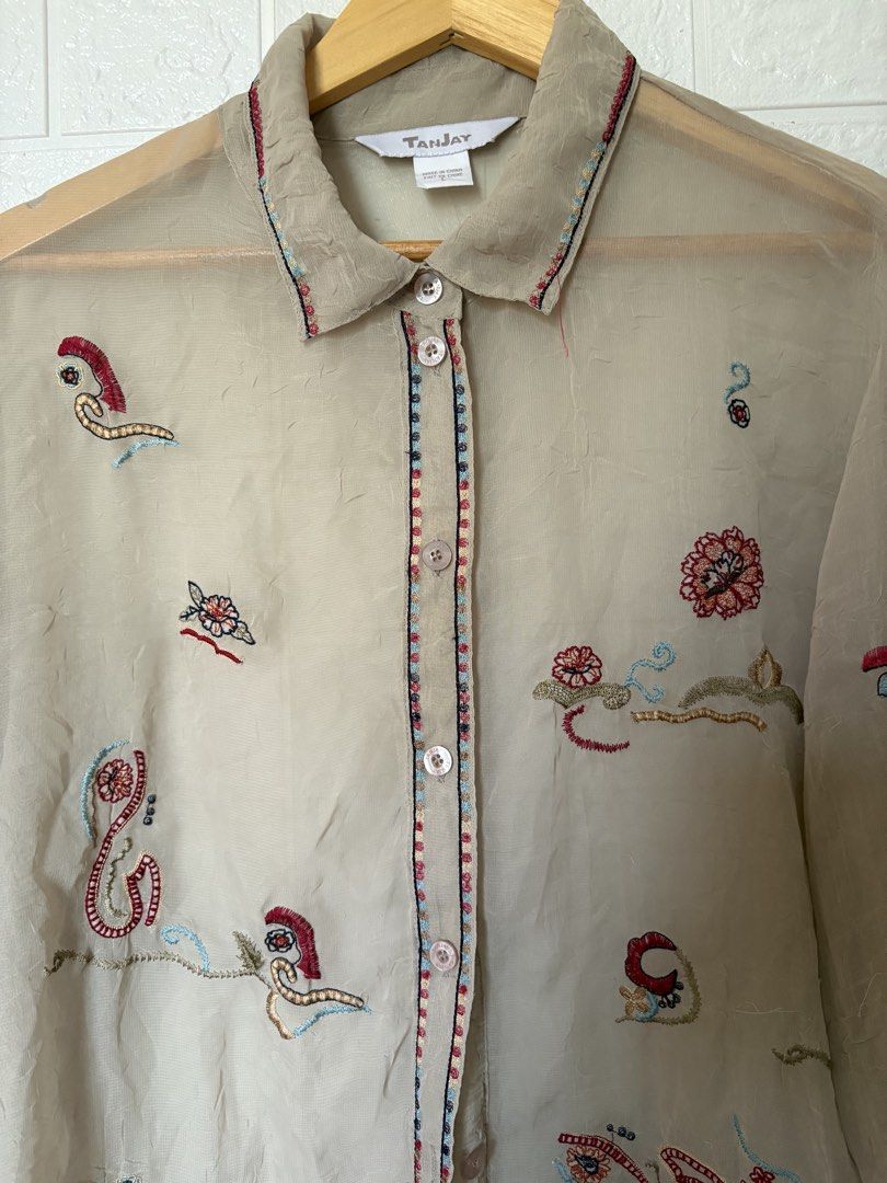 TanJay Sheer Embroidered Button-Down Shirt (Category: Blouses) located in Batangas. Submitted by purple_and_orange (Listing ID 1465184714, Image 3). Description: - Brand: TanJay - Color: Beige - Size: Large - Material/Style: Sheer fabric with colorful embroidered patterns, collared neck, and button placket - Origin: Made in China - Condition: Excellent, ready to wear.