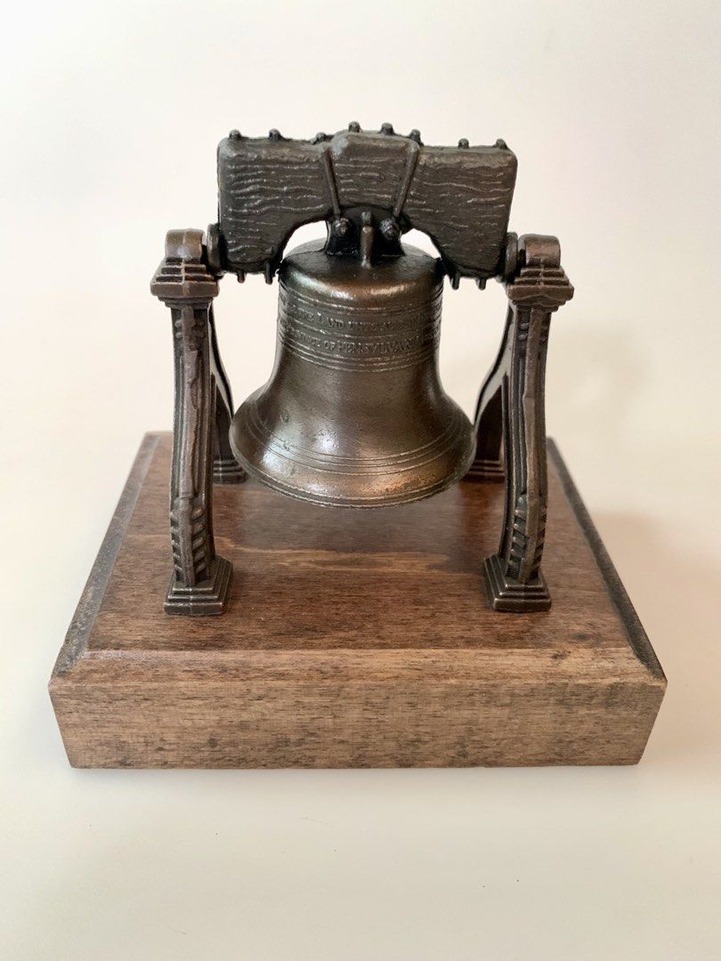 The Liberty Bell / Commemorative item (Category: Vintage Collectibles) located in Tandag. Submitted by jeason_22 (Listing ID 1465258759, Image 1). Description: • 5 inches tall • 5 inches wide • Wood base • Metal bell 🔔 .