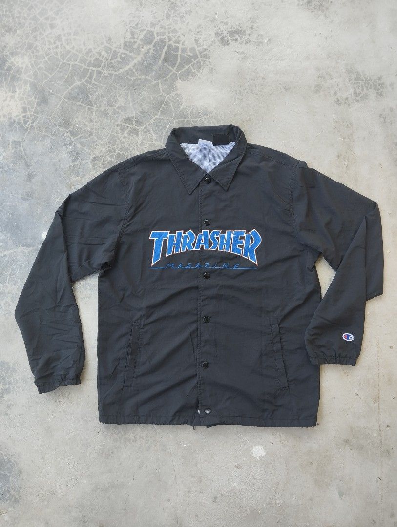 Thrasher x Champion Black Coaches Jacket Medium (Category: Coats, Jackets and Outerwear) located in Mati. Submitted by old_era.ph (Listing ID 1465171859, Image 1). Description: - Brand: Thrasher Magazine x Champion Collaboration - Item: Coaches Jacket - Color: Black with bold blue embroidered chest logo - Size: Medium - Details: Champion 'C' patch on left sleeve, snap button closure, standard collar, white mesh lining - Material: 100% nylon shell