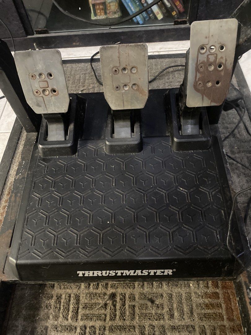 Thrustmaster T-GT Racing Wheel Shifter and Pedals (Category: Controllers) located in Pasay City. Submitted by upor.iv (Listing ID 1465174282, Image 3). Description: Thrustmaster setup includes the T-GT wheel, TH8A shifter, and three metal pedals. Lots of hours on this kit. Works fine for Gran Turismo and PC racing sims. Normal scuffs on the steering rim and pedal faces from regular driving. Shifter is solid with metal gate plate. Selling the whol