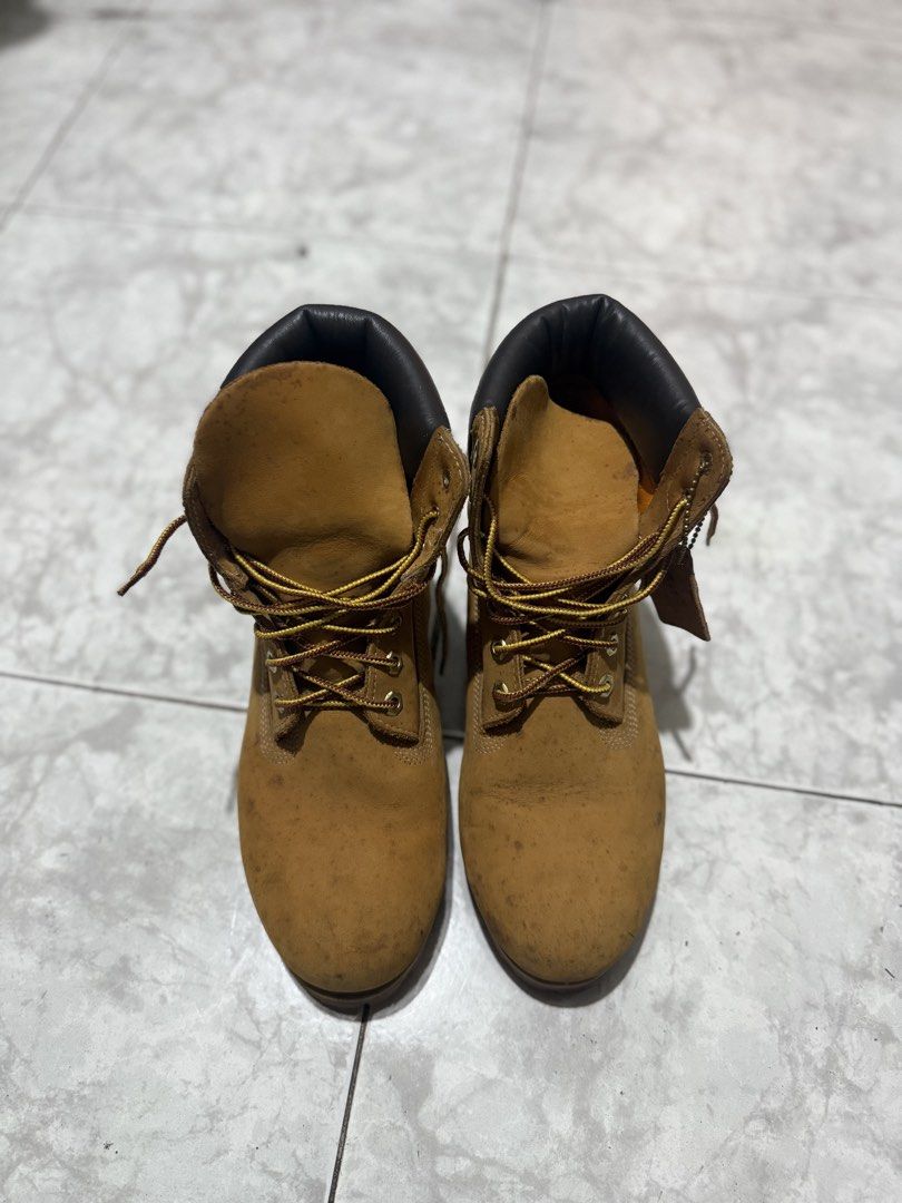 Timberland Classic Wheat Waterproof Boots (Category: Boots) located in Bacolod City. Submitted by kitcarsonduff (Listing ID 1465325038, Image 2). Description: - Brand: Timberland - Style: Classic Wheat Nubuck Boots - Color: Wheat with black padded collar - Laces: Original two-tone yellow and brown taslan laces - Soles: Rubber lug outsoles with great traction remaining, minor heel drag - Details: Embossed tree logo on side heel - Condition: Regula
