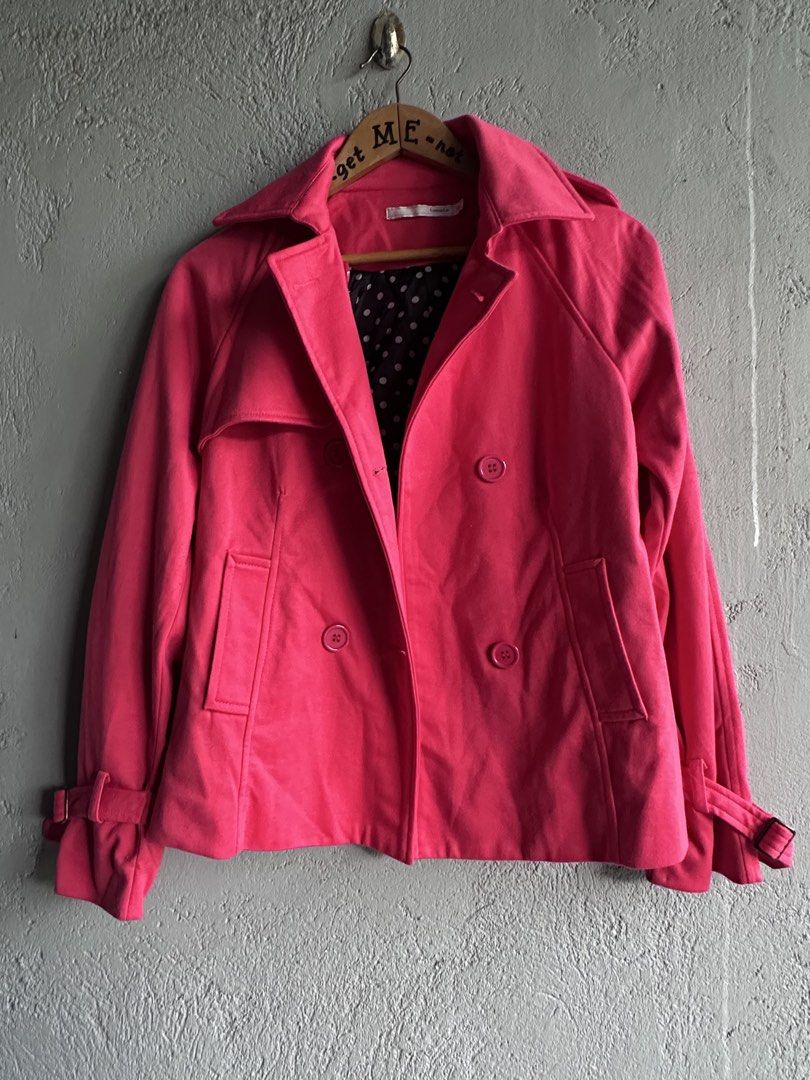 Tomato Double-Breasted Trench Jacket (Category: Coats, Jackets and Outerwear) located in Binan City. Submitted by forgetmenot_ph (Listing ID 1465255366, Image 3). Description: - Brand: Tomato - Size: Extra Small (XS) - Color: Red - Style: Double-breasted with classic lapel collar and button-up front - Details: Handy side pockets and cuffs with adjustable buckled straps - Interior: Black lining with white polka dots - Fit: Structured shoulders and