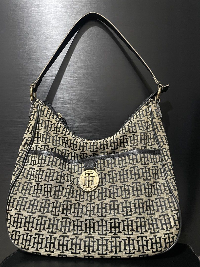 Tommy Hilfiger (Category: Shoulder Bags) located in Quezon City. Submitted by harajuuku (Listing ID 1465207011, Image 1). Description: Gold hardware Tommy Hilfiger shoulder bag. Can fit a lot of items. Has leather and canvas material. RFS: just sitting on my cabinet. I need to declutter po..