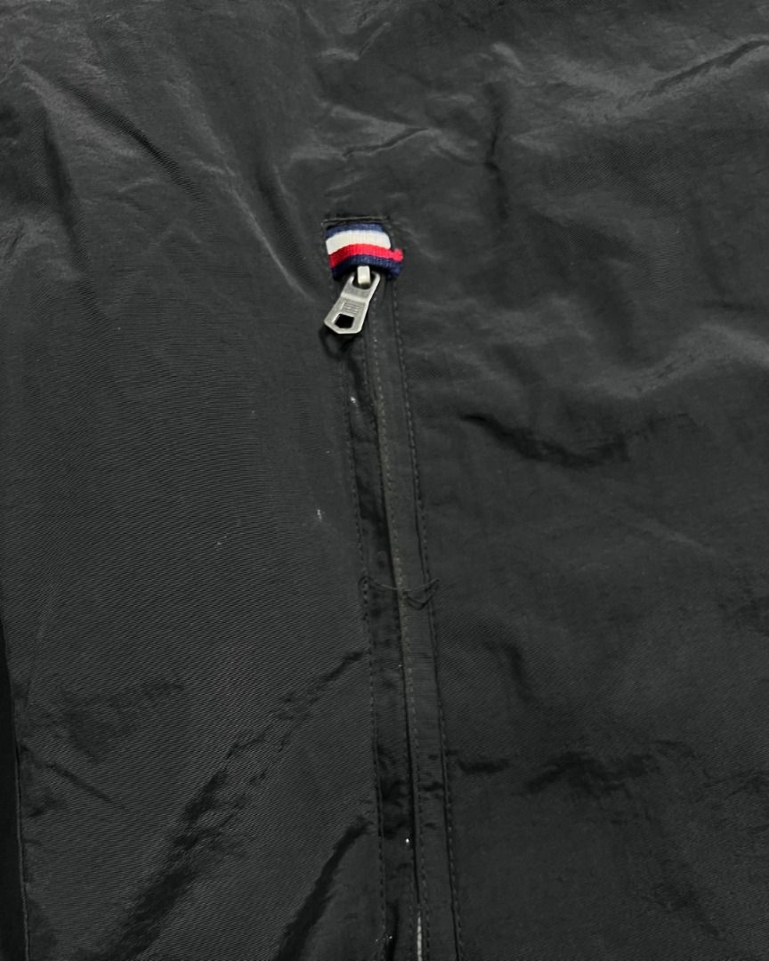 Tommy Hilfiger Black Sailing Jacket W/ Packable Hood (Category: Coats, Jackets and Outerwear) located in Baguio. Submitted by marcusmartin2600 (Listing ID 1465186110, Image 3). Description: Size: XL on tag Condition: Very good | signs of usage | white on the back can be washed | print fade 📏 Measurement via Tape Measure (in inches): Width: 26” Length: 28” Shoulders: 20” Sleeve Length: 27.5” Hem: 23.5” . Note: Please check detailed photos before 