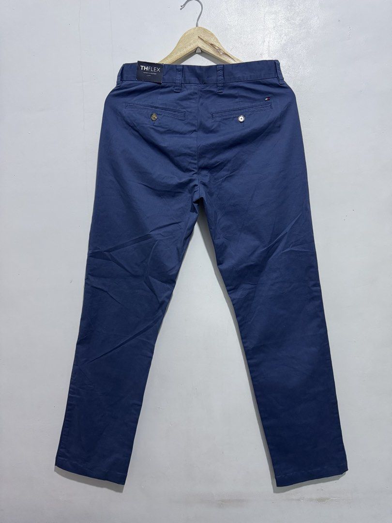 Tommy Hilfiger THFlex Blue Chino Pants (Category: Chinos) located in Manila. Submitted by esparciake75752 (Listing ID 1465280320, Image 3). Description: - Brand: Tommy Hilfiger (THFlex line) - Color: Dark Blue - Fit: Slim straight - Features: Standard front pockets, button-closure back pockets, belt loops, zipper fly, and THFlex branding tag - Condition: Great versatile option for work or weekend wear - Mode of payment: Gcash, Bank Transfer - Shi