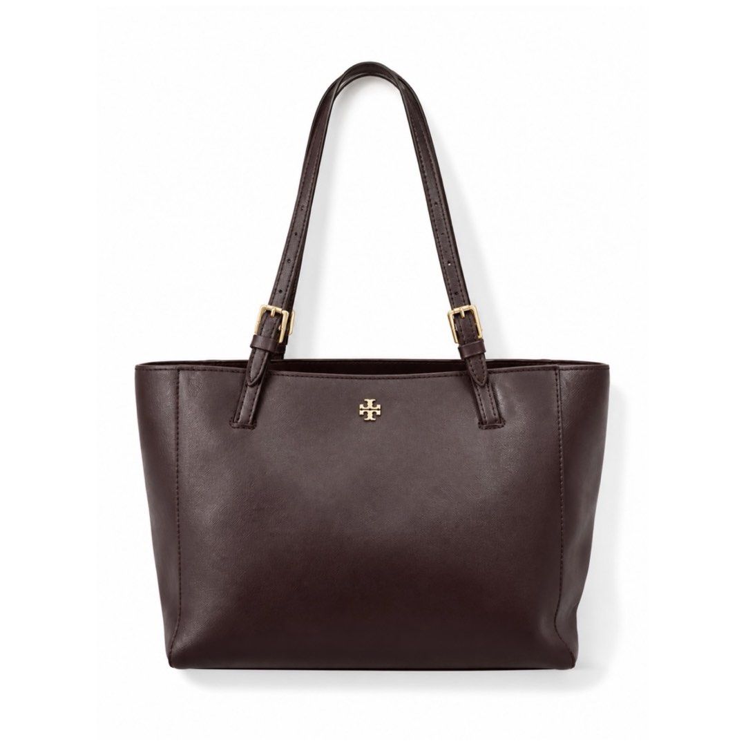 Tory Burch Dark Brown Leather Tote Bag (Category: Tote Bags) located in Cavite. Submitted by vanity_isme (Listing ID 1465338853, Image 1). Description: - Tory Burch Dark Brown Shoulder Bag - Hardware: Gold accents - Interior: Spacious with multiple compartments, zip pocket, and patterned fabric lining - Straps: Adjustable shoulder straps - Condition: Structured shape with minor scuff marks on the front and side exterior panels; clean interior lin