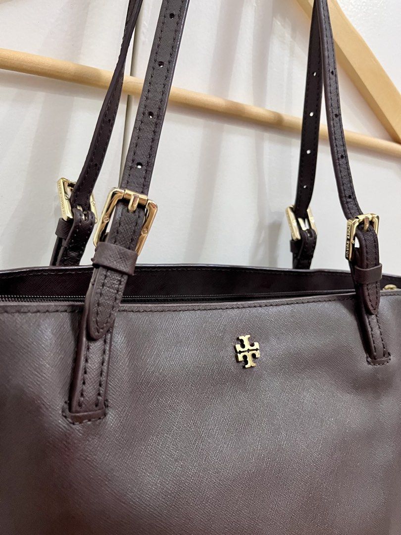Tory Burch Dark Brown Leather Tote Bag (Category: Tote Bags) located in Cavite. Submitted by vanity_isme (Listing ID 1465338853, Image 2). Description: - Tory Burch Dark Brown Shoulder Bag - Hardware: Gold accents - Interior: Spacious with multiple compartments, zip pocket, and patterned fabric lining - Straps: Adjustable shoulder straps - Condition: Structured shape with minor scuff marks on the front and side exterior panels; clean interior lin
