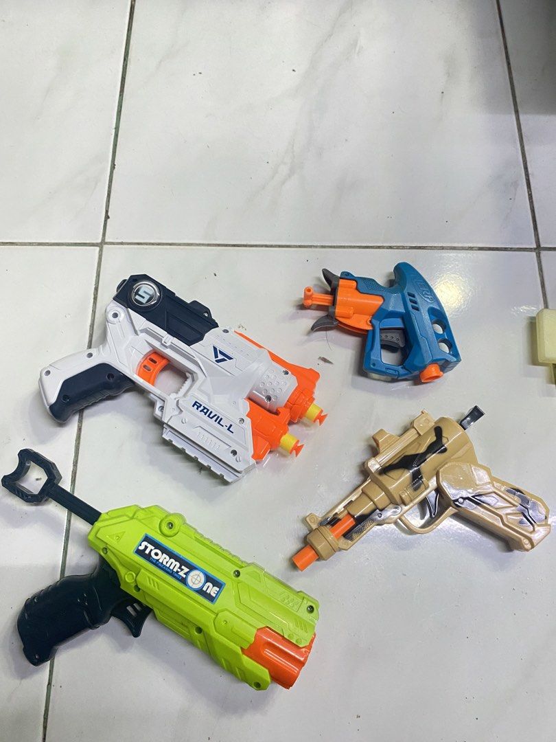 Toy Blaster Bundle with Minecraft Sword and Darts (Category: Action & Battle Toys) located in Cavite. Submitted by zyrahramos (Listing ID 1465228807, Image 3). Description: 🔫Massive toy blaster bundle featuring 6 awesome items 🔫Includes large green Carnivore blaster, Ravil-L blaster, Storm-Z One blaster, small blue blaster, and tan revolver-style toy gun 🔫Includes a cool plastic pixelated sword for melee action 🔫Comes with a huge stash of blu