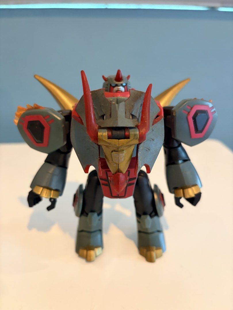 Transformers Animated Deluxe Class Snarl (2008) by Hasbro (Category: Figurines & Statues) located in Santa Rosa. Submitted by serf60762 (Listing ID 1465246114, Image 1). Description: Selling Transformers Animated Deluxe Class Snarl (2008) action figure by Hasbro for PhP 1.2K - Converts smoothly between robot and triceratops dinosaur mode - Features a striking red, grey, and gold color scheme - Fully articulated joints for dynamic posing - Sturdy 