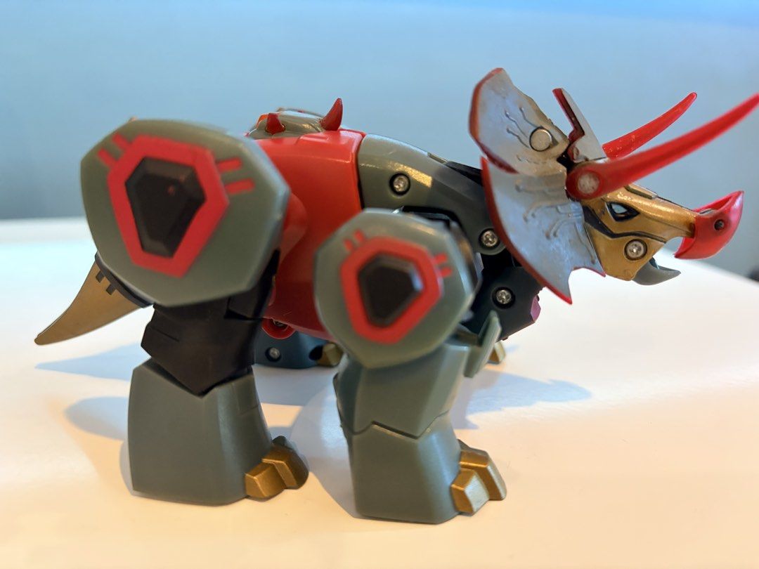 Transformers Animated Deluxe Class Snarl (2008) by Hasbro (Category: Figurines & Statues) located in Santa Rosa. Submitted by serf60762 (Listing ID 1465246114, Image 3). Description: Selling Transformers Animated Deluxe Class Snarl (2008) action figure by Hasbro for PhP 1.2K - Converts smoothly between robot and triceratops dinosaur mode - Features a striking red, grey, and gold color scheme - Fully articulated joints for dynamic posing - Sturdy 
