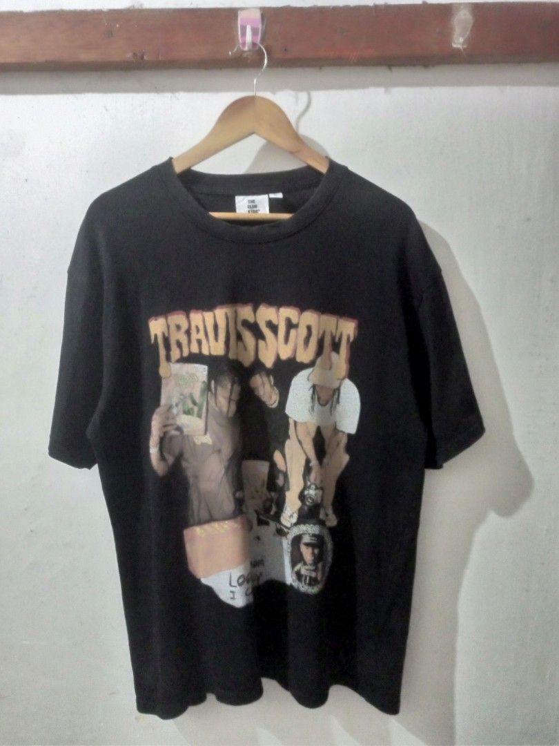 Travis Scott Black Graphic T-Shirt (Category: Tshirts & Polo Shirts ) located in Manila. Submitted by oxthrift (Listing ID 1465173959, Image 1). Description: - Color: Black - Design: Large Travis Scott graphic with bold yellow lettering on front - Fit: Standard crew neck - Material: Soft, comfortable cotton - Condition: Clean and ready to wear - Style: Perfect for everyday streetwear.