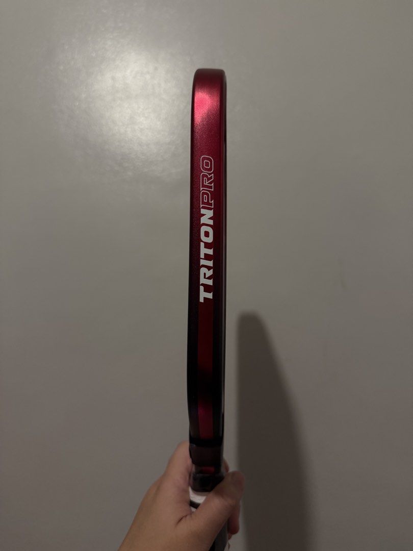 Triton 5 Cherry red (Category: Racket and Ball Sports) located in Manila. Submitted by chantalily23 (Listing ID 1465342403, Image 2). Description: with edge tape included as freebie.