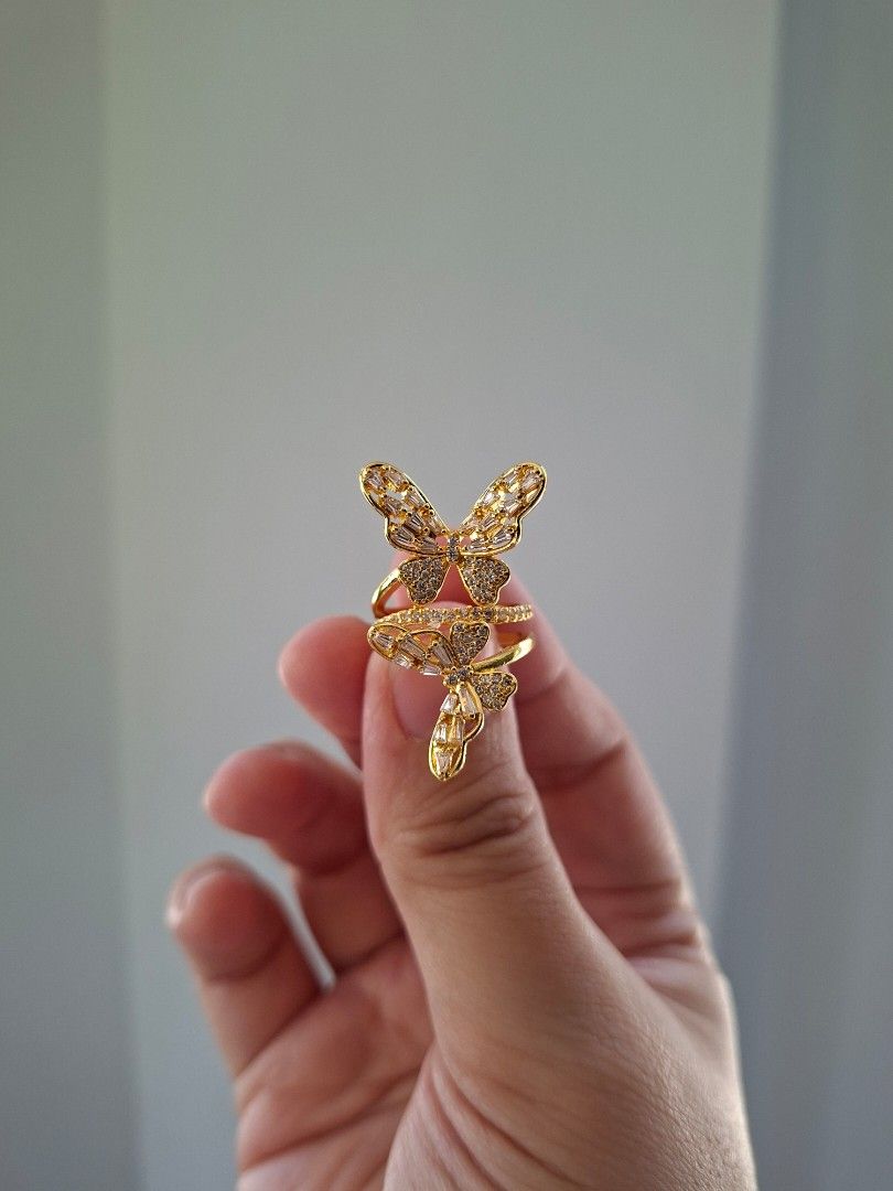 Twin Butterfly Designs Adjustable Gold Stainless Steel Ring (Category: Rings) located in Dasmarinas. Submitted by danabrie22 (Listing ID 1465214513, Image 2). Description: adjustable size 5 - 9 very well-made, excellent crafstmanship 10/10 condition brand new stainless steel & white-colored cubic zirconia stones made in Hongkong.
