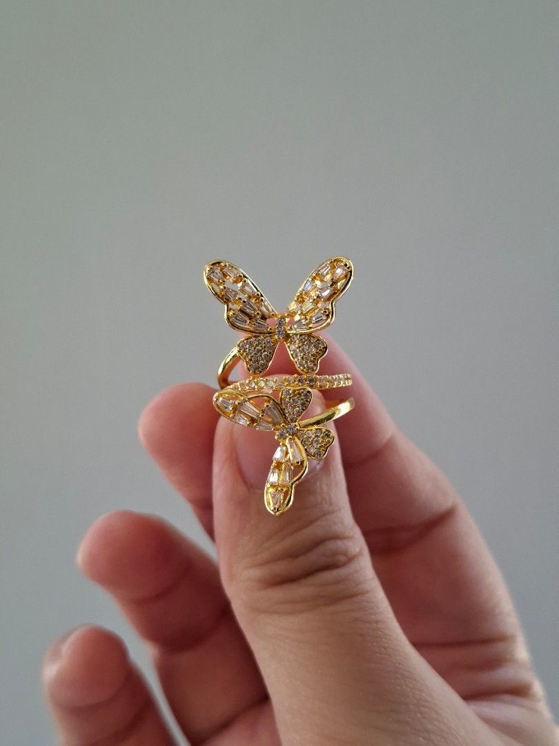 Twin Butterfly Designs Adjustable Gold Stainless Steel Ring (Category: Rings) located in Dasmarinas. Submitted by danabrie22 (Listing ID 1465214513, Image 1). Description: adjustable size 5 - 9 very well-made, excellent crafstmanship 10/10 condition brand new stainless steel & white-colored cubic zirconia stones made in Hongkong.