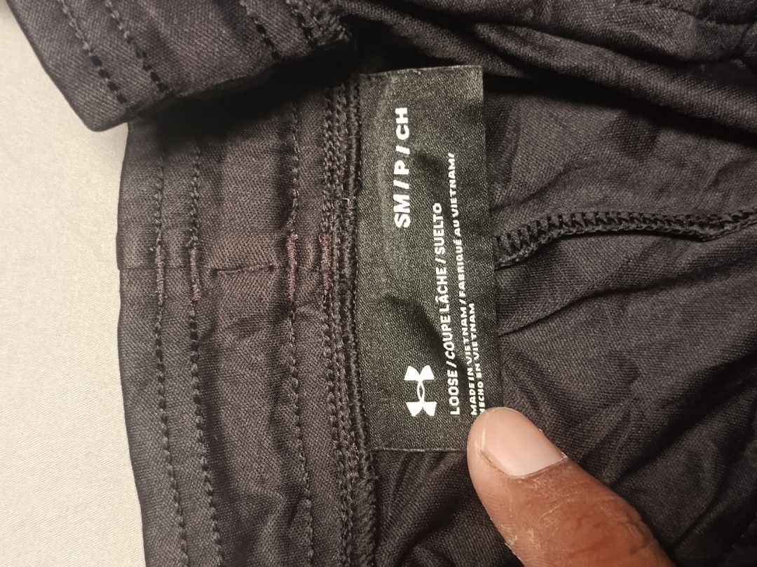 Under Armour Performance Apparel Black Shorts Size S (Category: Shorts) located in City of Isabela. Submitted by warmbird.d06e6f (Listing ID 1465224145, Image 2). Description: - Brand: Under Armour Performance Apparel - Style: Loose fit athletic shorts - Size: Small - Color: Black with bright orange drawstring and matching leg logo - Condition/Origin: Made in Vietnam - Measurements: ~15 inches across waist (laid flat), ~16 inches total length - I
