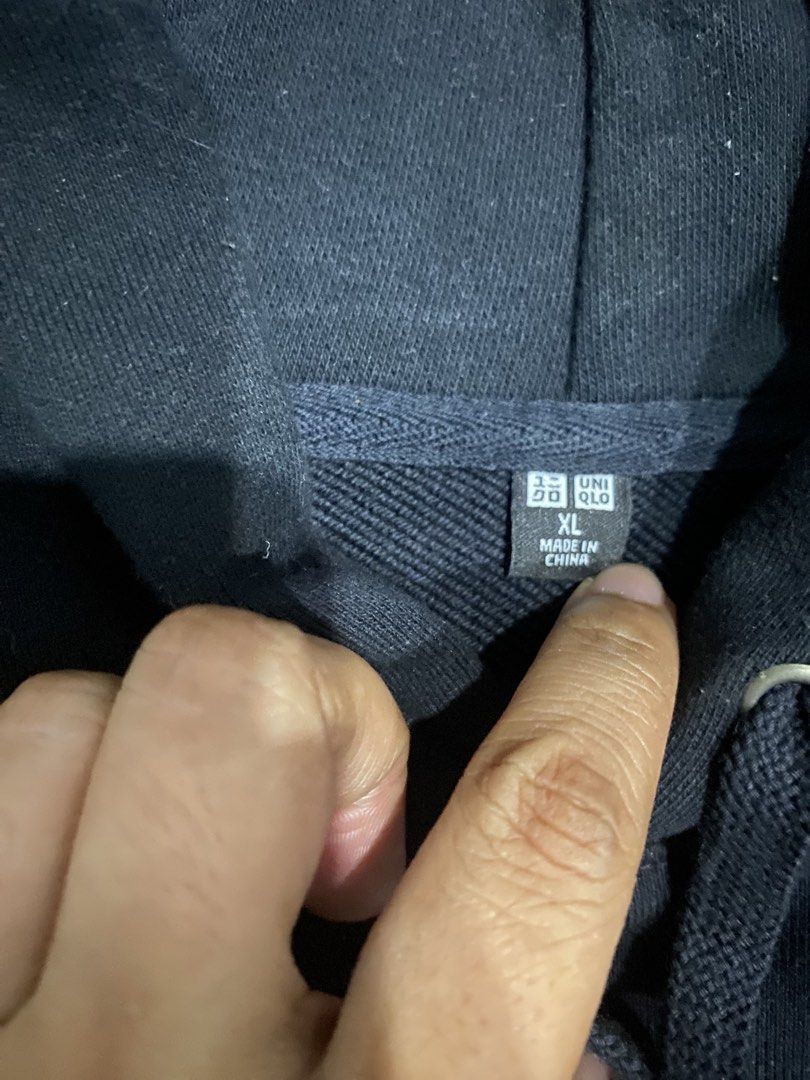 Uniqlo Black String Hoodie Size XL (Category: Hoodies) located in Quezon City. Submitted by wantitkept (Listing ID 1465273241, Image 2). Description: - Brand: Uniqlo - Color: Solid Black - Size: XL - Material: Soft and warm fleece lining - Features: Working drawstrings, front kangaroo pocket, ribbed cuffs and hem to maintain shape - Design: Plain back, highly versatile and easy to match with any outfit.