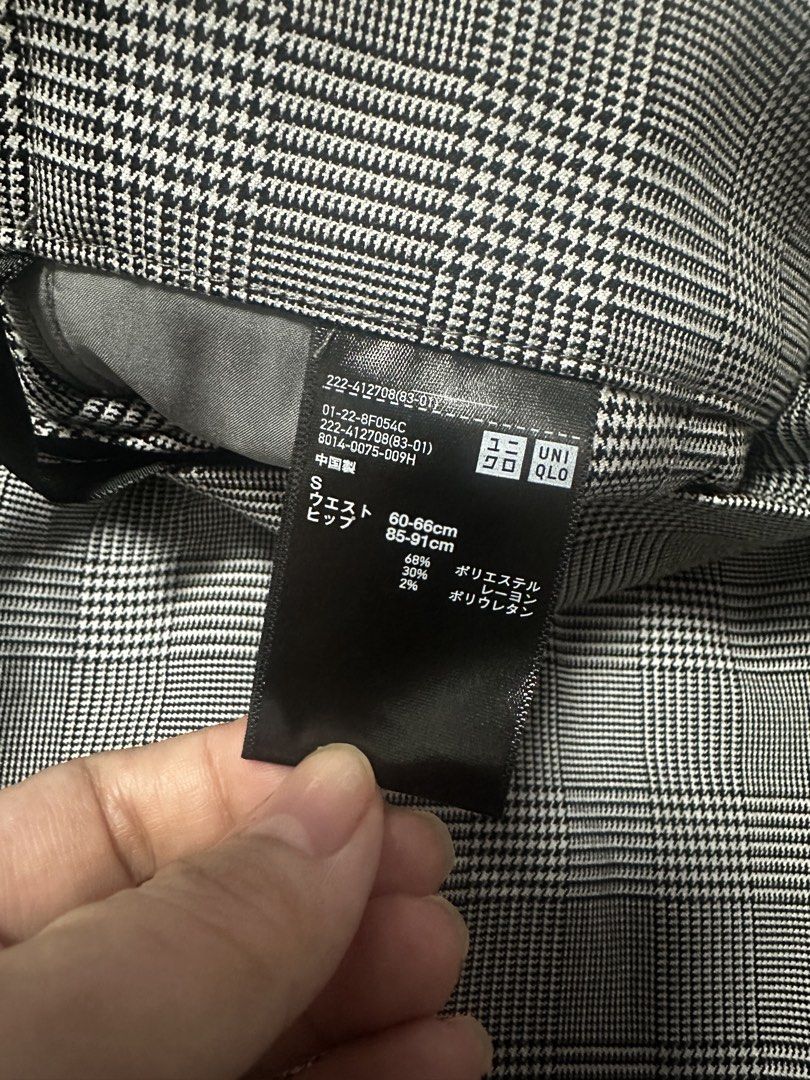 Uniqlo Plaid Midi Skirt (Category: Skirts) located in Quezon City. Submitted by mihoho13 (Listing ID 1465344348, Image 2). Description: - Brand: Uniqlo - Item: Grey and black plaid midi skirt - Size: S (Fits waist 60-66cm, hips 85-91cm) - Material: 68% polyester, 30% rayon, 2% polyurethane - Design: Classic plaid pattern, structured waistline, and neat front drape - Versatility: Great for office wear or casual outings.