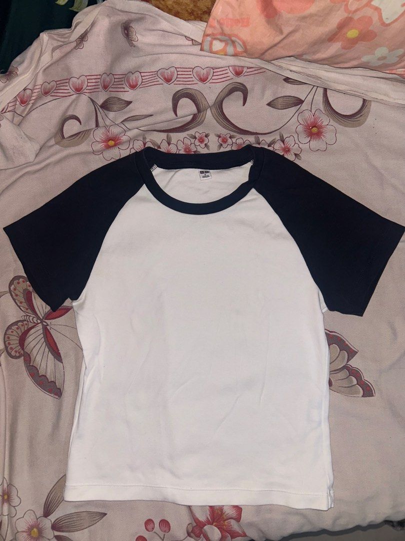 Uniqlo Raglan Mini Shirt (Category: Shirts) located in Mandaluyong City. Submitted by mariamadeline (Listing ID 1465341241, Image 1). Description: - Brand: Uniqlo - Style: Classic raglan tee (white body with black sleeves and collar) - Size: Small.