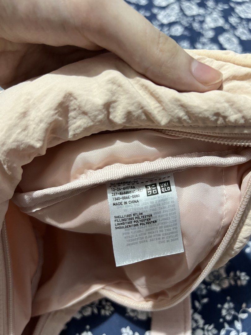 Uniqlo Round Mini Shoulder Bag Light Pink (Category: Cross-body Bags) located in Manila. Submitted by colesj (Listing ID 1465172543, Image 2). Description: - Brand: Uniqlo Round Mini Shoulder Bag - Color: Light Pink - Material: Durable and lightweight nylon - Features: Adjustable strap, smooth zipper closure, and convenient interior pocket - Condition Note: Inside pocket has a few minor ink stains near the bottom lining (does not affect outer app