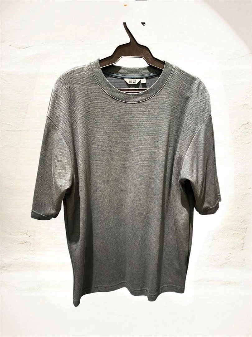 Uniqlo Shirts & Polo (Pre-owned) (Category: Tshirts & Polo Shirts ) located in Quezon City. Submitted by trade_mnl (Listing ID 1465346966, Image 2). Description: - Brand: Uniqlo - Style: Short sleeve & button-up shirt - Fit: Boxy, relaxed fit for easy styling - Details: Regular collar, front button closure, and two utility chest pockets with flaps - Comfort: Lightweight mesh interior lining for enhanced breathability - Condition: Lightly used & g