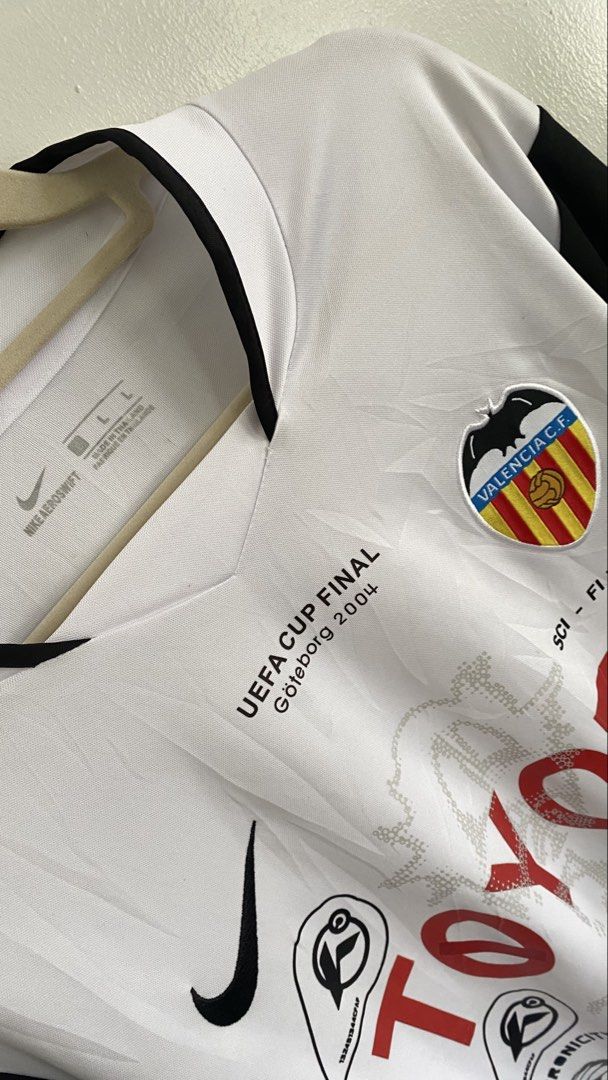 Valencia CF Nike UEFA Cup Final 2004 Fantasy Jersey (Category: Activewear) located in Bacolor. Submitted by toyk_thrift.ph (Listing ID 1465243717, Image 3). Description: VALENCIA FC | 03/04 Home Dimes (In Inches) Width: 21.5 Length: 29 Size: l-xl Issue (s): minimal hairlines (A) Condition: Good as New.