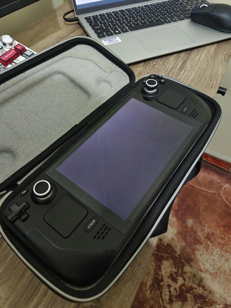Valve Steam Deck LCD 256gb (Category: Others) located in Cavite. Submitted by anya16 (Listing ID 1465283762, Image 3). Description: STEAM DECK LCD 256gb Inclusions: - Unit (No issues) - Charger - Adaptor - Carry Case RFS: bibili ng g7x.
