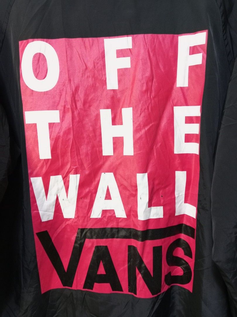 Vans Black Coach Jacket With Big Back Logo (Category: Coats, Jackets and Outerwear) located in Manila. Submitted by onewikstraight (Listing ID 1465362718, Image 3). Description: - Brand: Vans - Item: Coach Jacket - Color: Black with pink and white back graphic - Features: Button-down front, secure zippered side pockets, classic collar, and elastic cuffs - Details: Small embroidered Vans chest logo and large 'Off The Wall' box graphic on the back 