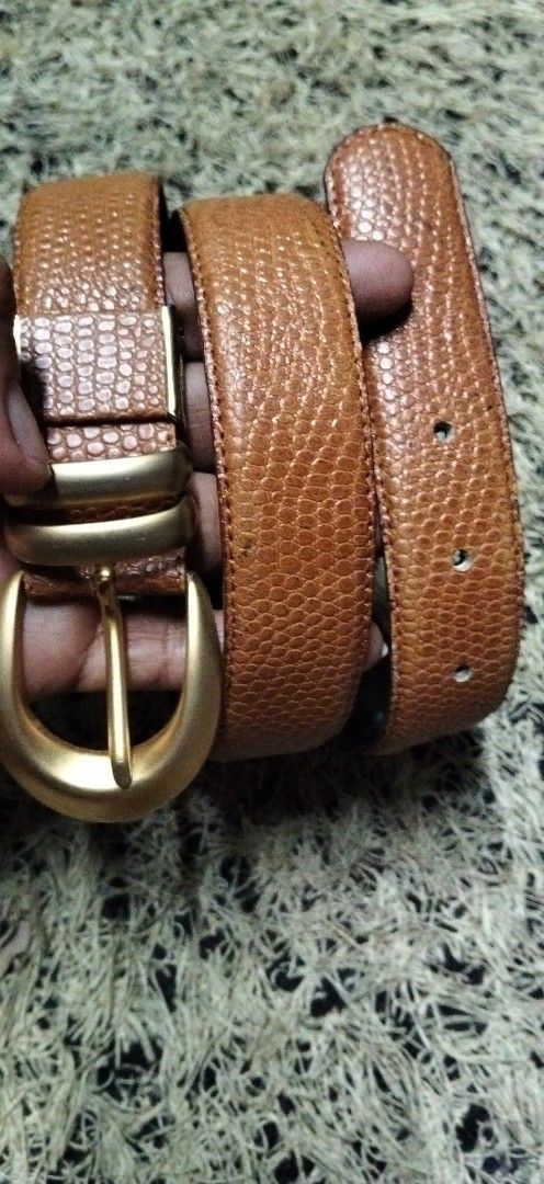 Vast Vane Textured Brown Belt with Gold Hardware (Category: Belts) located in Paranaque City. Submitted by michael-08 (Listing ID 1465252149, Image 1). Description: - Brand: Vast Vane - Color: Brown with black interior lining - Material/Texture: Textured finish - Hardware: Matte gold buckle and double keeper loops - Details: Signature logo stamped near the tail end with standard hole adjustments - Style: Perfect for casual or smart-casual outfits