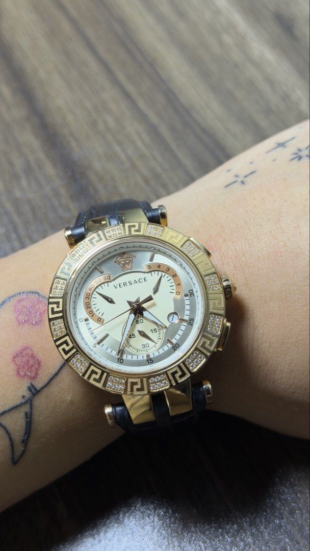 Versace V-Race Chronograph (Category: Luxury Accessories) located in Baguio. Submitted by fndrskprskid (Listing ID 1465252145, Image 2). Description: - Authentic Swiss-made Versace watch in working order - Sapphire Crystal - White and silver dial featuring chronograph subdials and date window - Iconic Medusa head logo at the 12 o'clock position - Genuine black leather strap with Versace-branded deployment clasp - 42MM Issue: Back strap lining - B