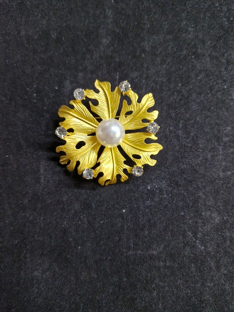 Vibrant Bloom Brooch (Category: Brooches) located in Taguig. Submitted by mommaschoice (Listing ID 1465340367, Image 1). Description: Brand New Gold-Tone finish Adorned w/ faux pearl and rhinestones Adds elegance to one's outfit Ships nationwide.