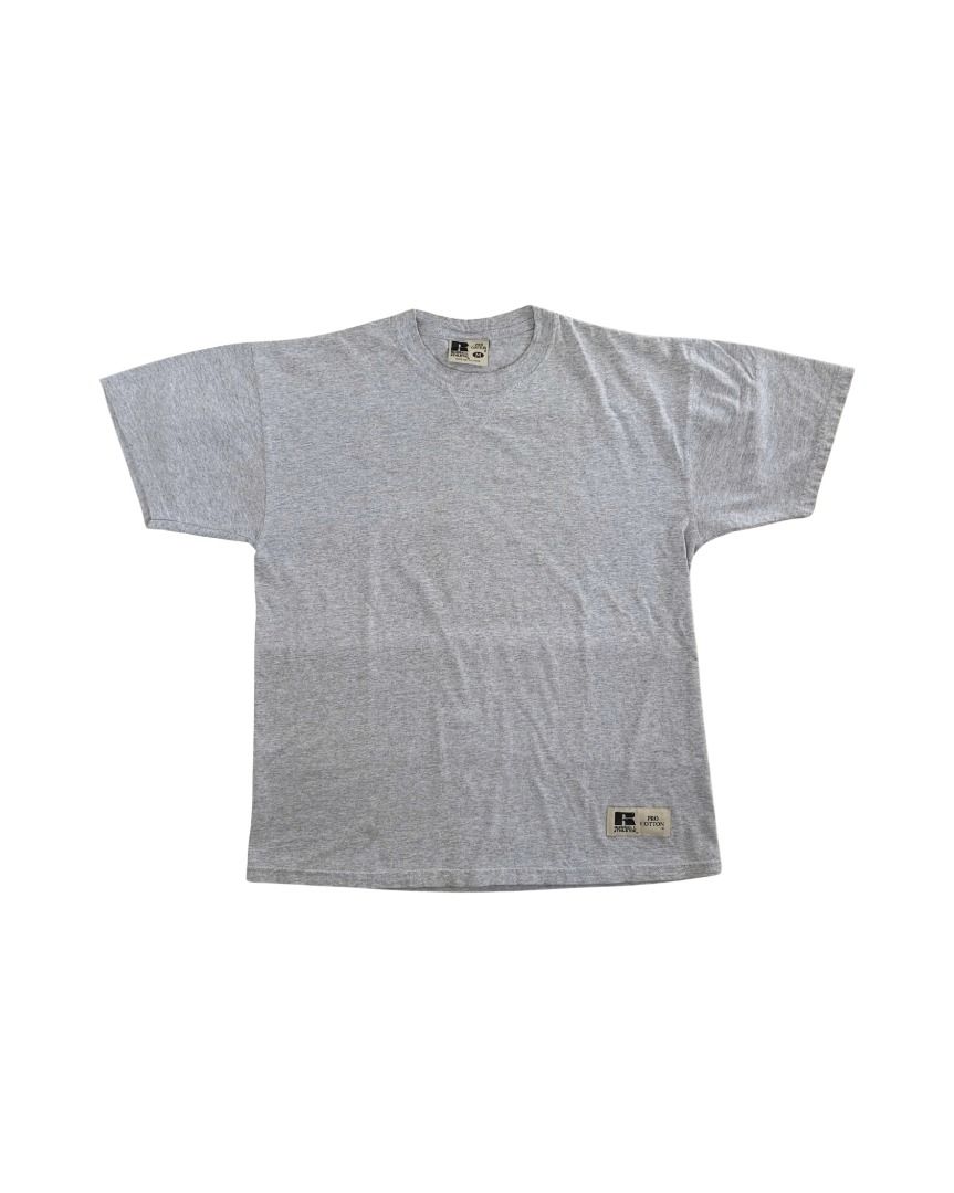 Vintage 1990s RUSSELL ATHLETIC Blank Tee (Category: Tshirts & Polo Shirts ) located in Cebu City. Submitted by threadless.vtg (Listing ID 1465335557, Image 3). Description: Vintage 1990s RUSSELL ATHLETIC Blank Tee Tag: Russell Athletic Size: M Color: Gray (color may vary due to lighting) Condition: Good Measurements: 21" W × 26.5" L Issue: Minor stains near bottom hem PHP 400 🚚 Free nationwide shipping Bulk orders may require additional shipping