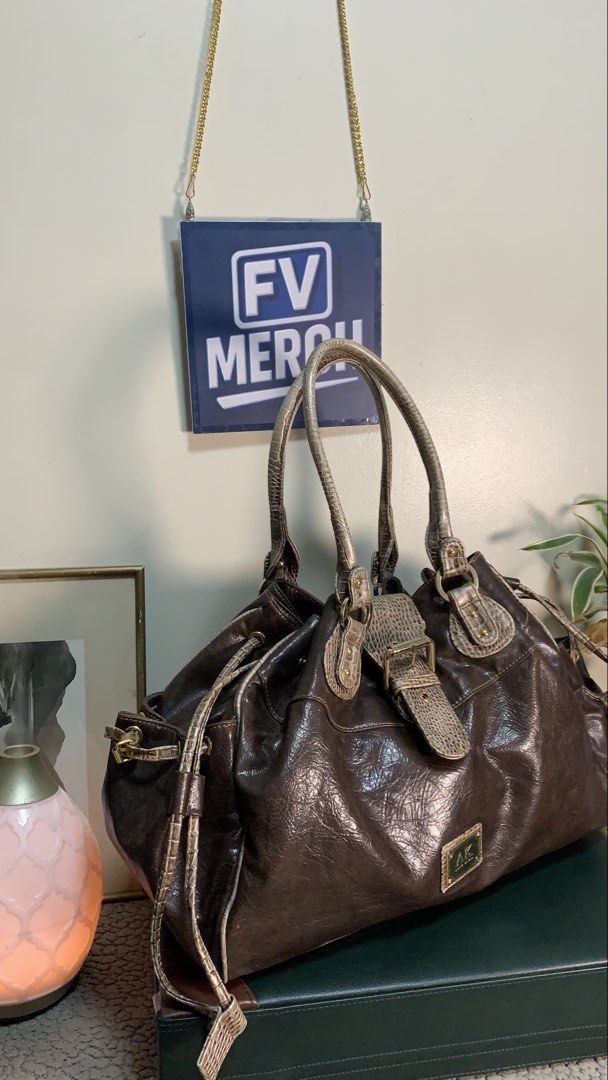 vintage AK Anne Klein | brown leather (Category: Shoulder Bags) located in Mandaluyong City. Submitted by fv_merch (Listing ID 1465273764, Image 3). Description: ₱ 1250 vintage AK Anne Klein | brown leather satchel shoulder bag; gold-tone signature hardware plaque. Issues: Minor Sign of Usage; More photos in comment section. ⚠ DISCLAIMER: All brand names, logos, and trademarks belong to their respective owners and are used for identification/auth
