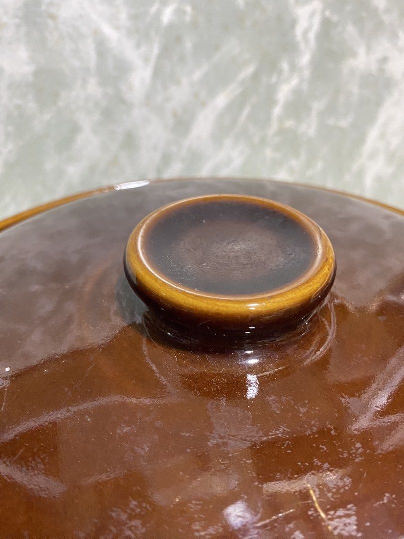 Vintage Brown Glazed Ceramic Lidded Casserole (Category: Cookware & Accessories) located in Calamba. Submitted by chebvintagedepot (Listing ID 1465283176, Image 2). Description: [T-B03-02] This vintage brown ceramic lidded casserole has a simple rustic farmhouse style associated with mid-20th-century kitchenware. The gives it a traditional look suitable for display, collecting, or kitchen décor. Measurements: 7 inches H x 10 inches D Note: The li