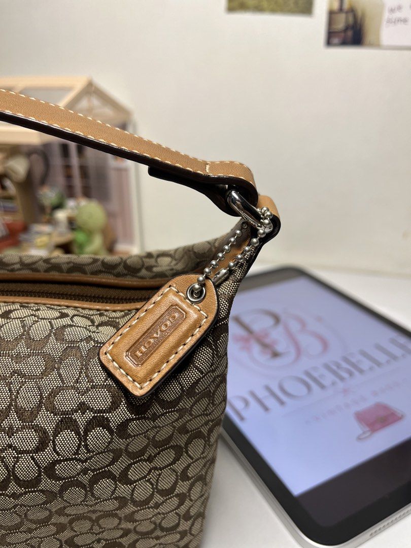 Vintage Coach Mini Kili Bag (Category: Tote Bags) located in Manila. Submitted by phoebellebypau (Listing ID 1465340785, Image 2). Description: 𝐑𝐀𝐍𝐊 𝐒𝐀 🤎 Inclusions: - generic dust bag - Silica Gel - Fragrance beads • 100% Authentic • Japan Sourced only 🇯🇵 • Minor signs of use on handle • Clean canvas and everything is still intact • Aunthentic YKK zippers & CCH tag.