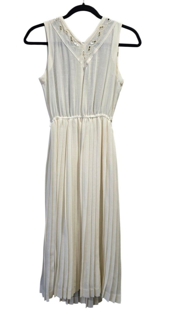 Vintage Cream Dress (Category: Dresses) located in Makati City. Submitted by lolachicph (Listing ID 1465235382, Image 2). Description: MEASUREMENTS (inches) Length: 41 laid flat Waist: 24-28 elastic Chest: 15 laid flat armpit to armpit Shipping: GRAB/LALA/ANGKAS booked and paid for by the buyer. Location: Legaspi Village Makati -Color: Cream - Style: Sleeveless V-neck midi dress with eyelet embroidery. With lining on skirt, no lining on top. - Fi