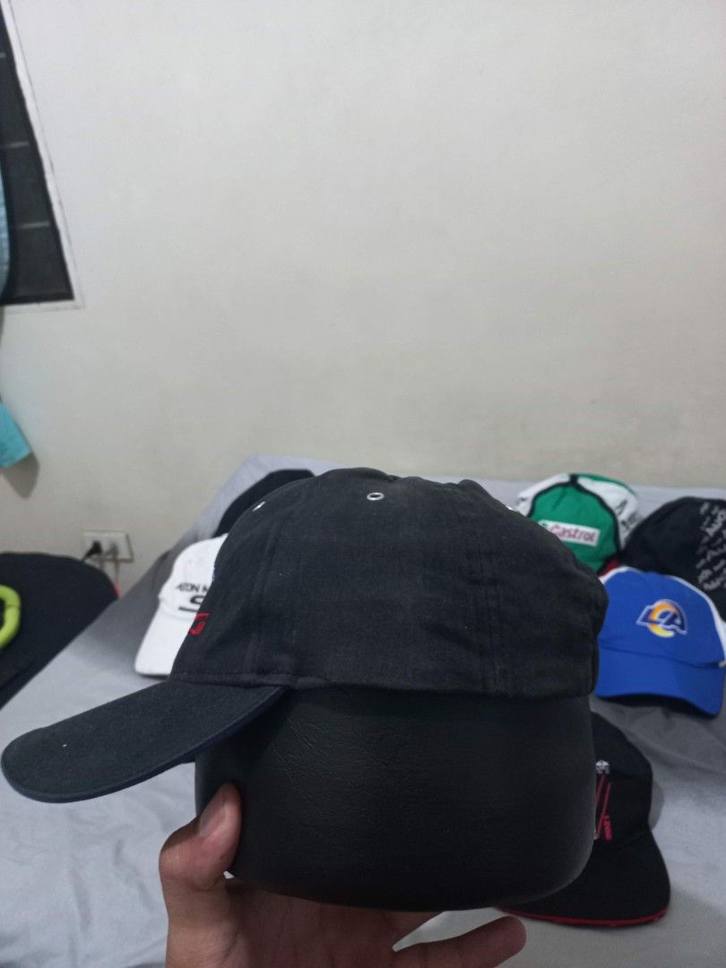 Vintage Ford Racing Black Cap (Category: Caps & Hats) located in Davao. Submitted by thegraildept2026 (Listing ID 1465178711, Image 2). Description: - Color: Classic Black - Brand: Ford Racing - Style: Dad hat / Baseball cap - Details: Embroidered logo on the front - Closure: Adjustable strap with metal buckle - Condition: Clean with minor signs of handling.