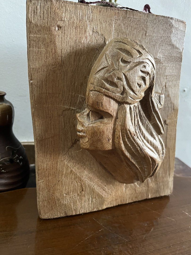 Vintage solid wood ,Hand-carve , native boy Profile Wall Plaque (Category: Wall Decor) located in Taguig. Submitted by minmin_parker (Listing ID 1465224631, Image 3). Description: - Unique hand-carved wooden wall plaque - Features a profile of a woman with textured hair and headdress details - Mounted on a sturdy rectangular wooden block - Comes with a hanging string attached at the top for easy display - Natural wood grain with warm brown tones 