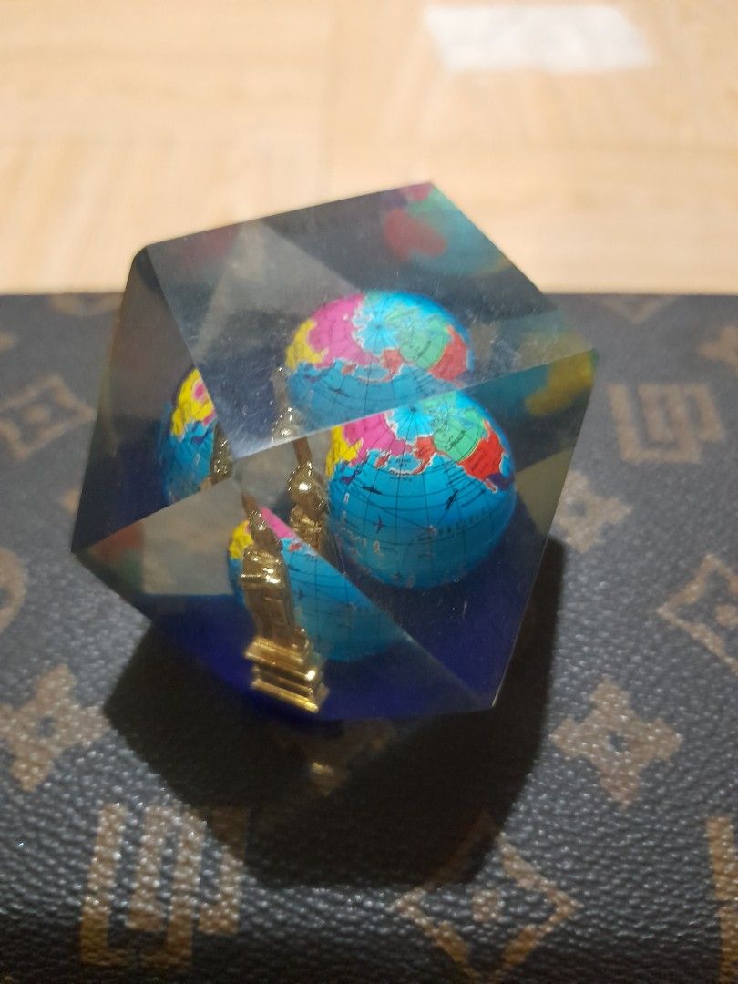 Vintage Liberty Globe Table Decor / Paperweight (Category: Vintage Collectibles) located in Bocaue. Submitted by marajapansurplus (Listing ID 1465315291, Image 3). Description: - Material: Clear faceted resin with a heavy, flat-bottomed base - Design: Encloses a multi-colored mini globe and a golden monument figurine - Visuals: Geometric block reflects light from multiple angles - Condition: Excellent, no major surface scratches - Ideal Use: Grea