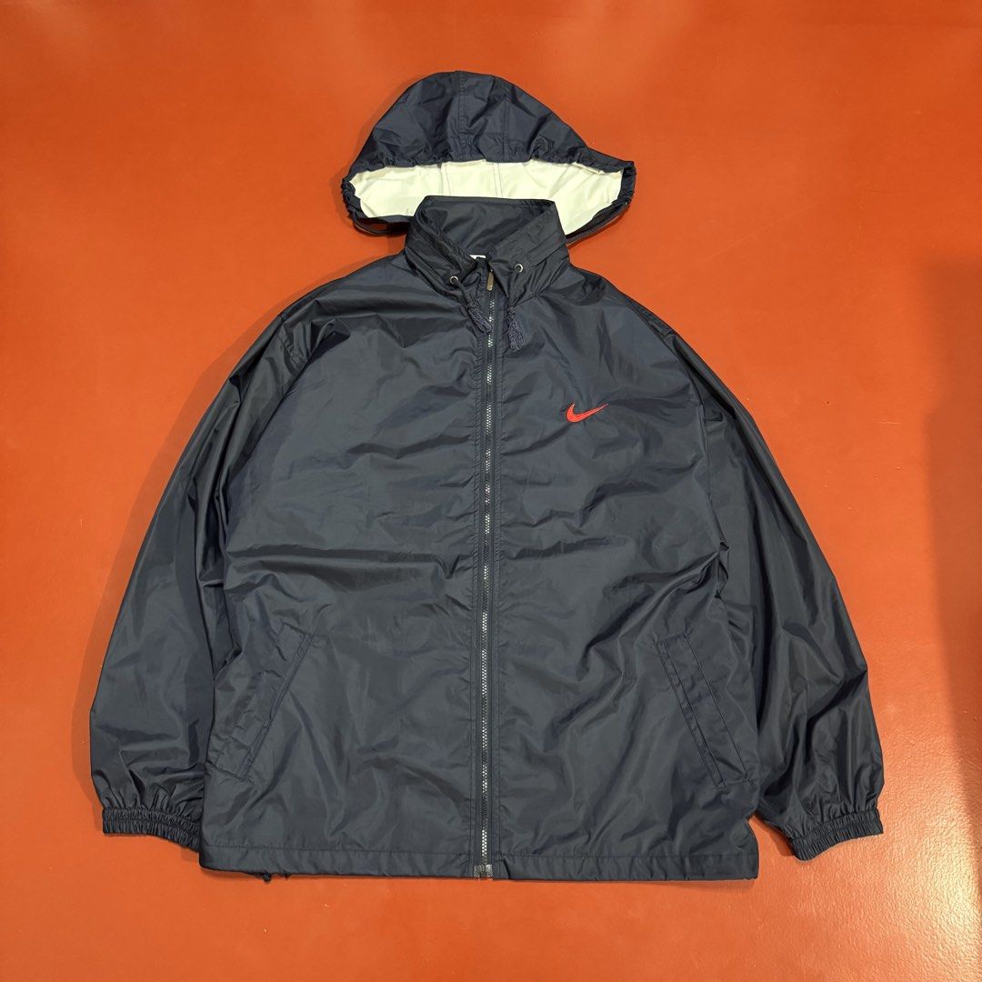 VINTAGE NIKE WINDBREAKER WITH PACKABLE HOOD (Category: Coats, Jackets and Outerwear) located in Pasig City. Submitted by buzzthrifty (Listing ID 1465307306, Image 1). Description: SIZS 2-3XL 26x29 GOOD AS NEW .