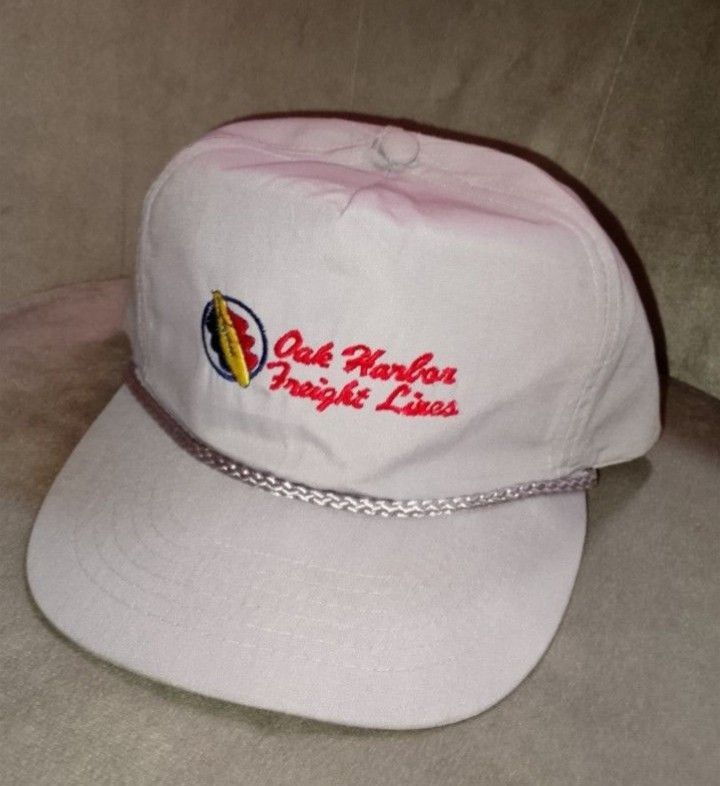 Vintage Oak Harbor Freight Lines Tan Snapback Hat - No Problem Brand (Category: Caps & Hats) located in Binangonan. Submitted by yuristalin888 (Listing ID 1465173241, Image 2). Description: Add some retro logistics style to your collection with this vintage Oak Harbor Freight Lines snapback hat. The cap features a light tan/beige crown, a braided rope across the base of the crown, and a classic embroidered "Oak Harbor Freight Lines" logo with a c