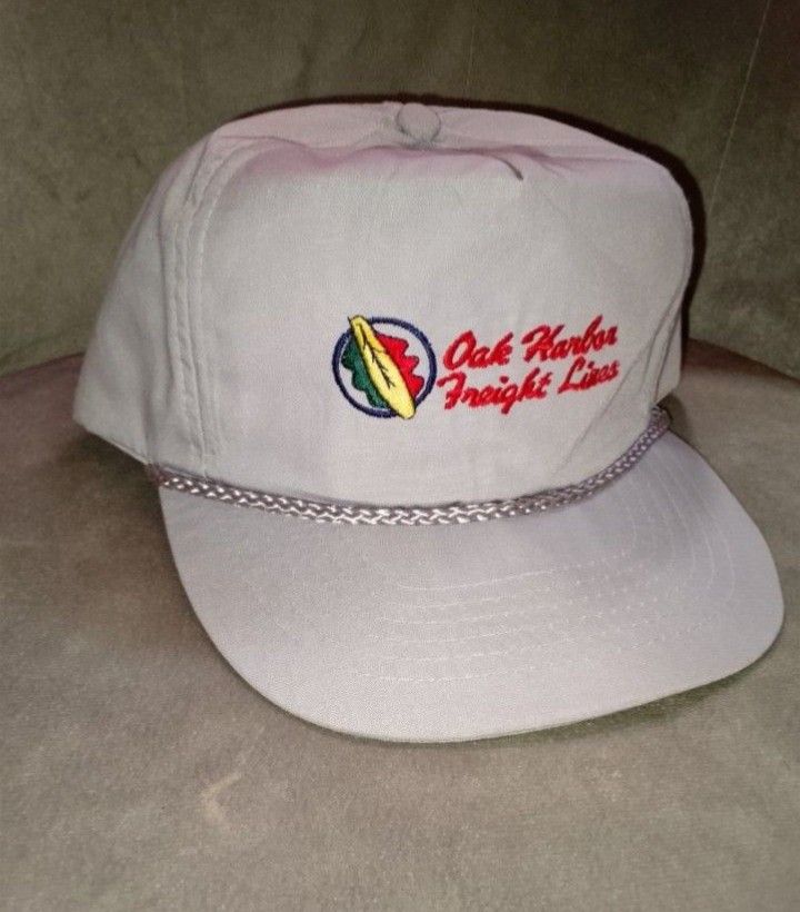 Vintage Oak Harbor Freight Lines Tan Snapback Hat - No Problem Brand (Category: Caps & Hats) located in Binangonan. Submitted by yuristalin888 (Listing ID 1465173241, Image 3). Description: Add some retro logistics style to your collection with this vintage Oak Harbor Freight Lines snapback hat. The cap features a light tan/beige crown, a braided rope across the base of the crown, and a classic embroidered "Oak Harbor Freight Lines" logo with a c