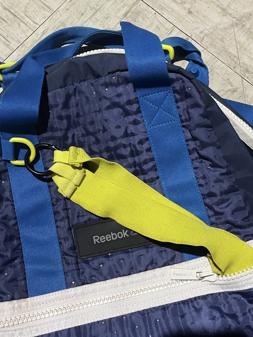Vintage Reebok Blue and Yellow Casual Backpack (Category: Backpacks) located in Makati City. Submitted by byamary (Listing ID 1465314284, Image 2). Description: - Authentic Reebok backpack in navy blue with striking bright blue shoulder straps and yellow pull tabs - Built-in mesh pocket inside for easy organization of essentials .