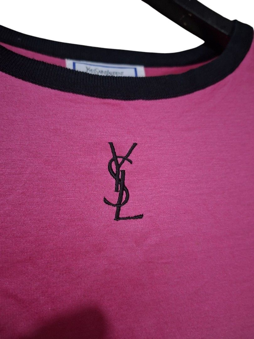 Vintage Yves Saint Laurent Pink Ringer (Category: Shirts) located in Leyte. Submitted by jpsrvd19 (Listing ID 1465296527, Image 3). Description: - Brand: Yves Saint Laurent (YSL) - Color: Vibrant pink with contrast black ribbing - Size: Medium (100% cotton) - Details: Embroidered YSL monogram logo on chest, classic woven neck and care tags - Condition: Soft and comfortable fit - Ideal for: Casual wear or YSL collectors.